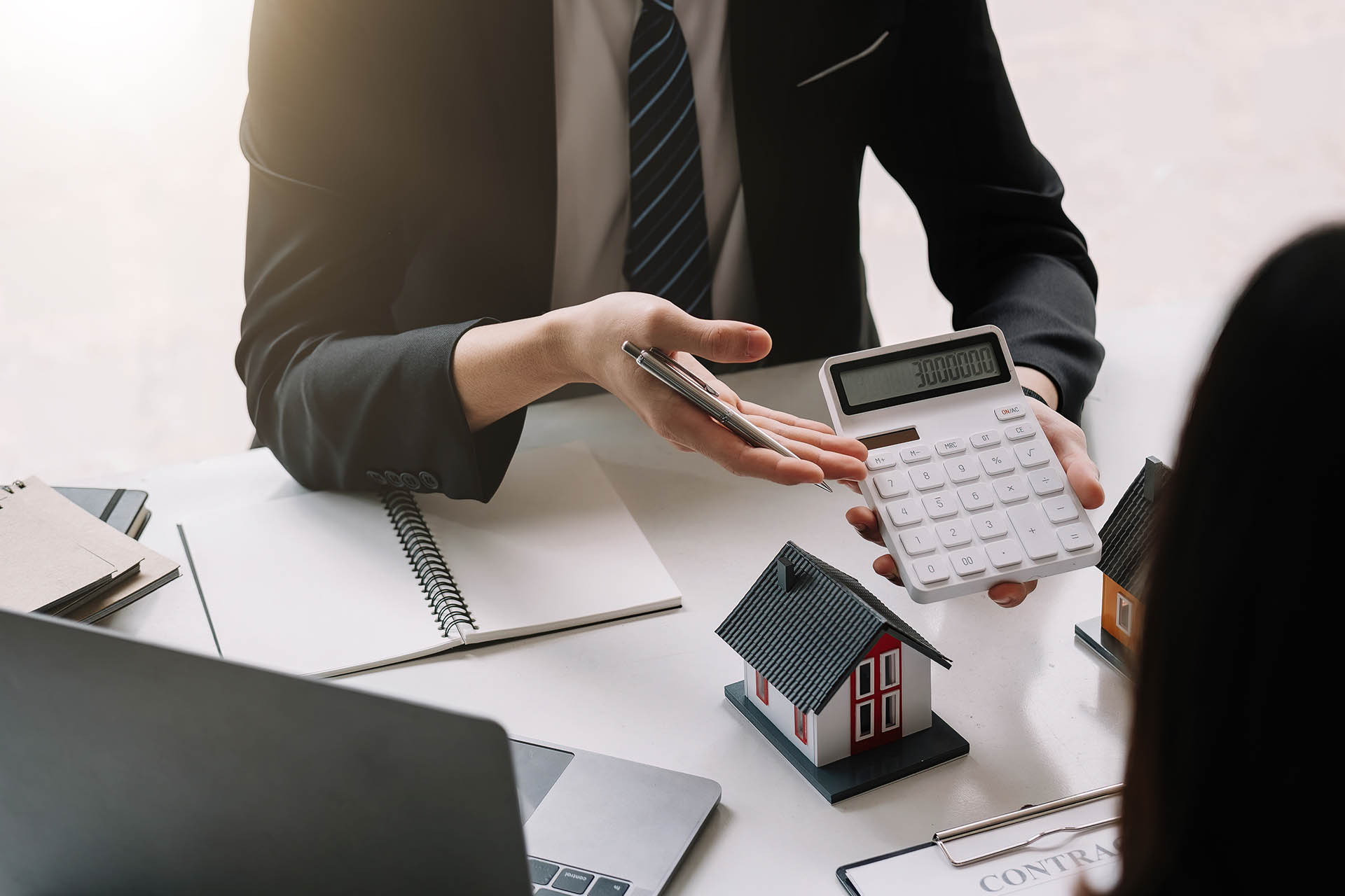 Real Estate Agents Standing by For Rent Sign